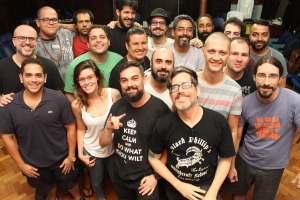 A group of smiling people posing for a photo after a seminar